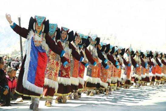 Traditional Ladakhi festival with performers in vibrant attire